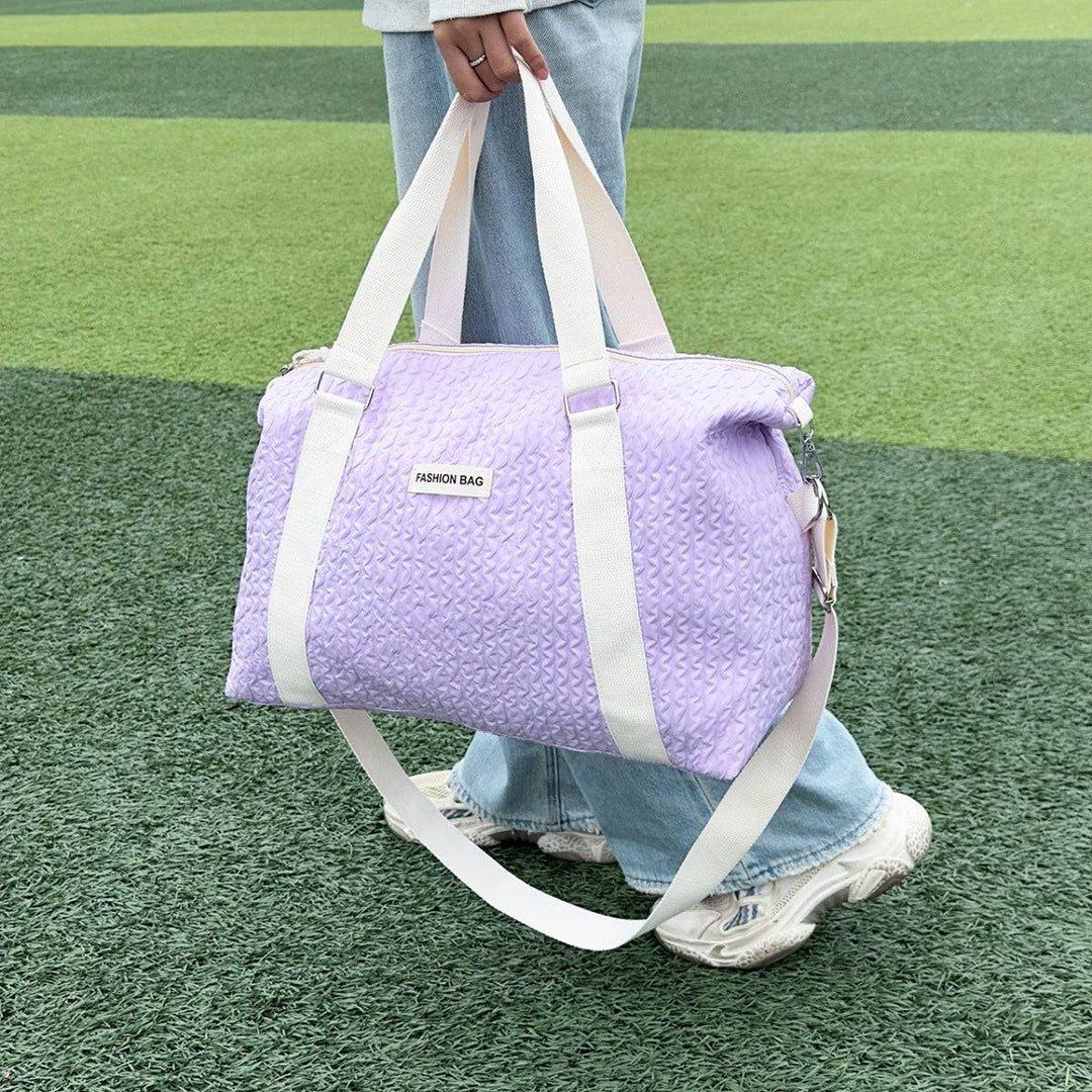 a person carrying a purple bag on a field