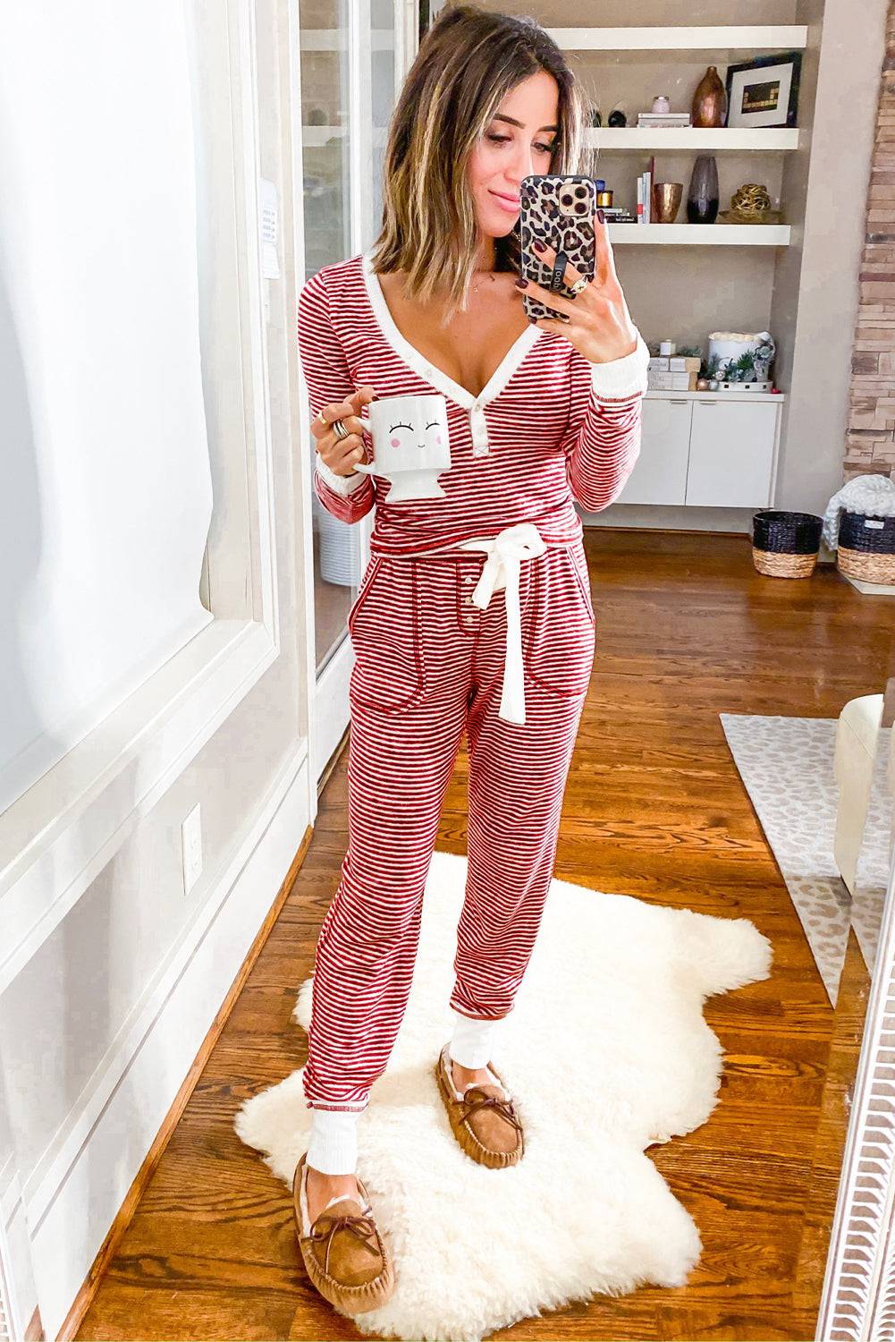 a woman taking a selfie in her pajamas