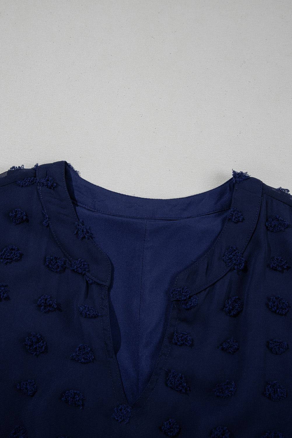 Notched neckline close-up of Navy Blue Dotty Textured Plus Ruffled Dress, highlighting elegant cut and Swiss dot texture.