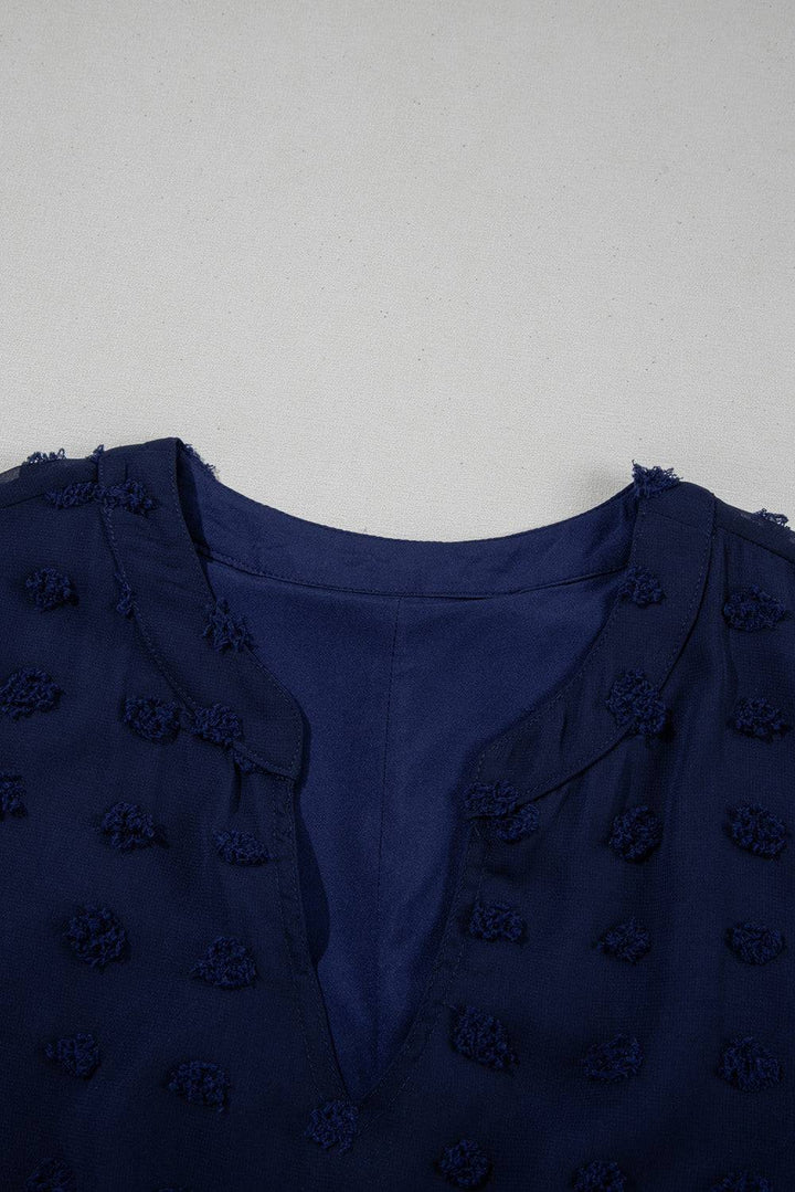 Notched neckline close-up of Navy Blue Dotty Textured Plus Ruffled Dress, highlighting elegant cut and Swiss dot texture.