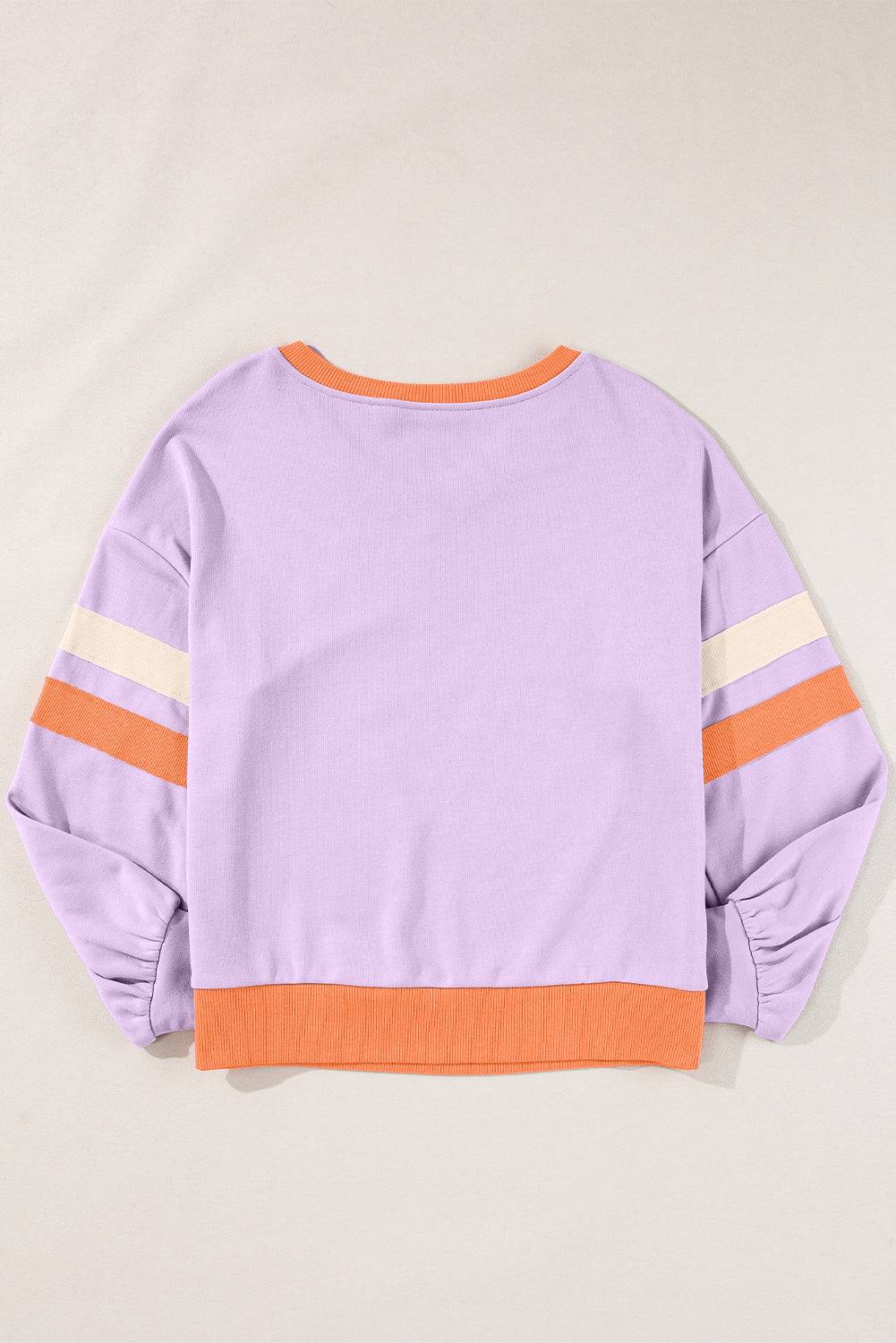 a purple sweatshirt with orange and white stripes