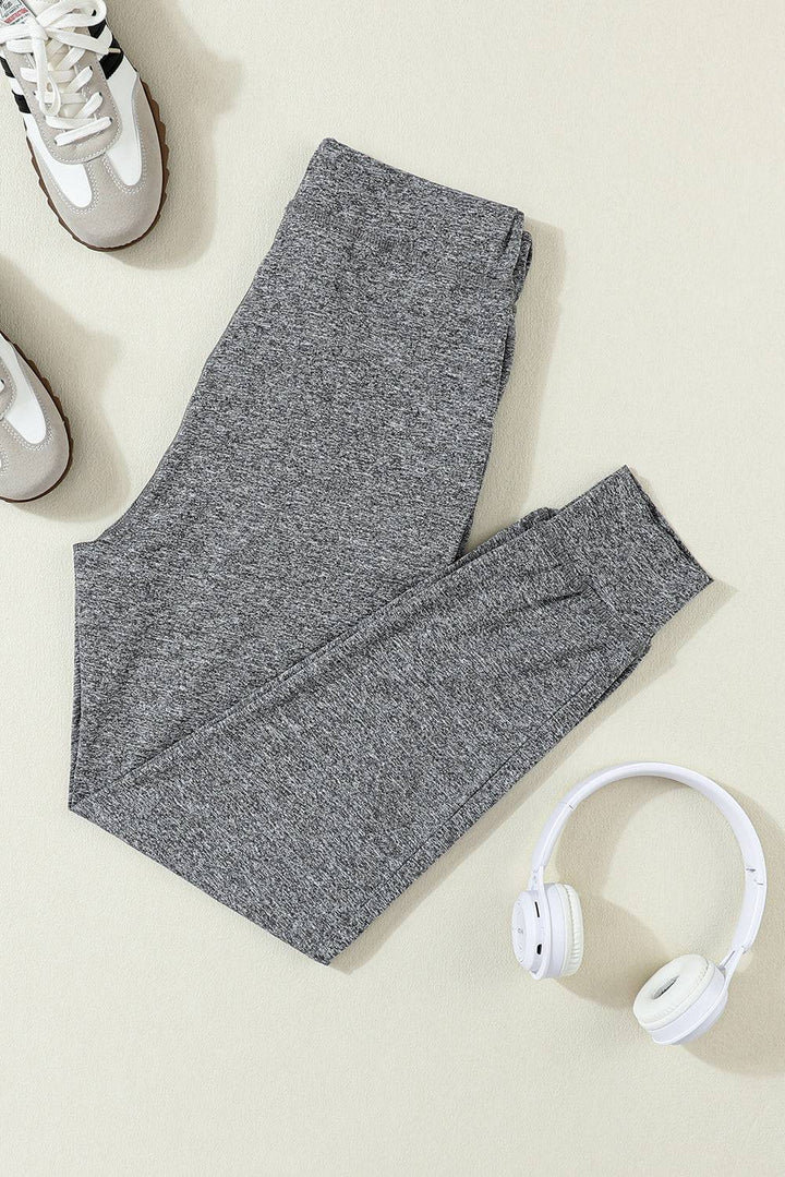 a pair of headphones and a pair of gray pants