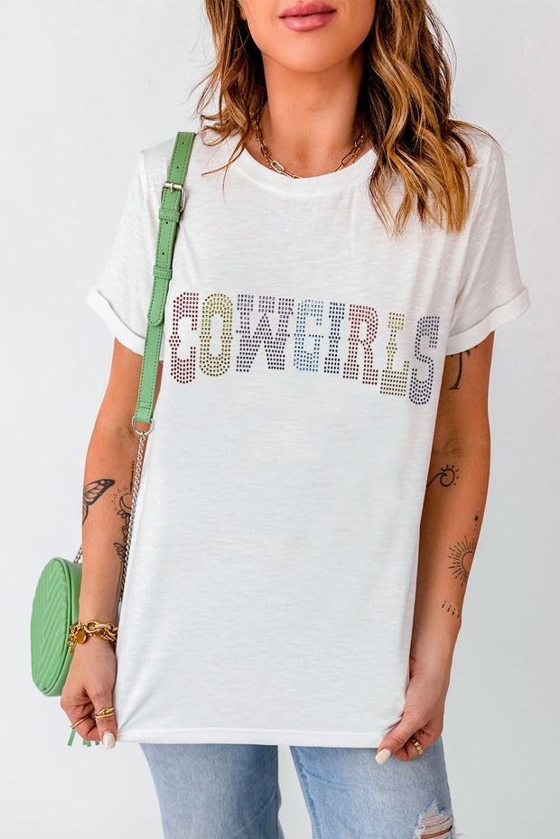 a woman wearing a white shirt with the words cowgirls on it