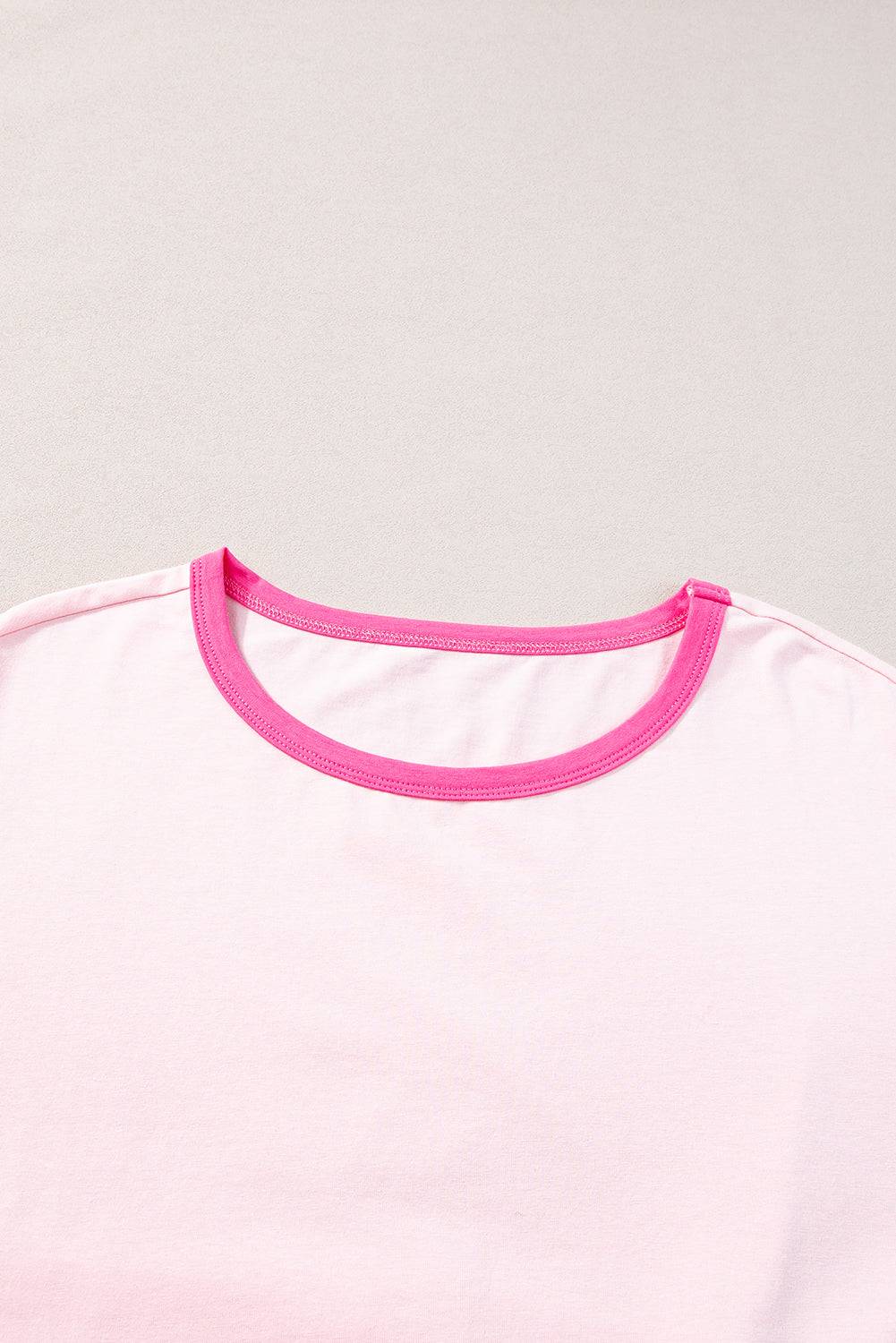 a white shirt with pink trim on a white background