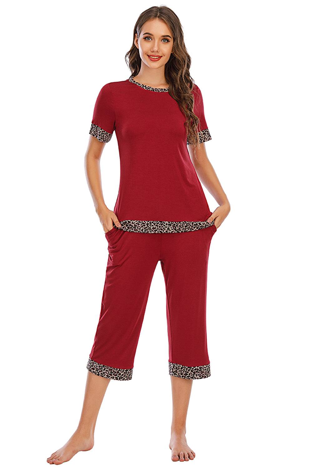 a woman wearing a red top and pants