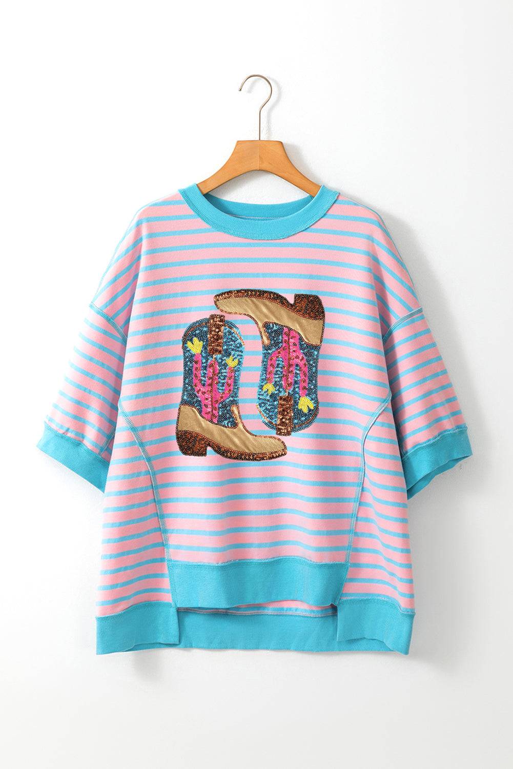 a pink and blue striped shirt with a cowboy boot on it