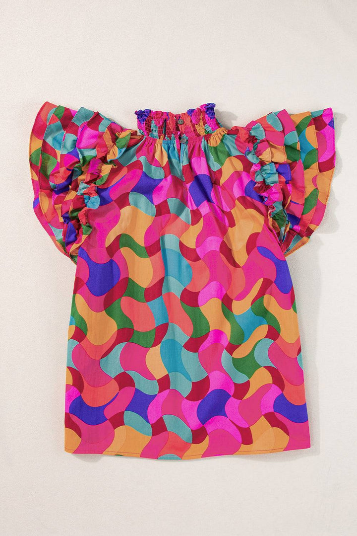 a child's blouse with colorful circles on it