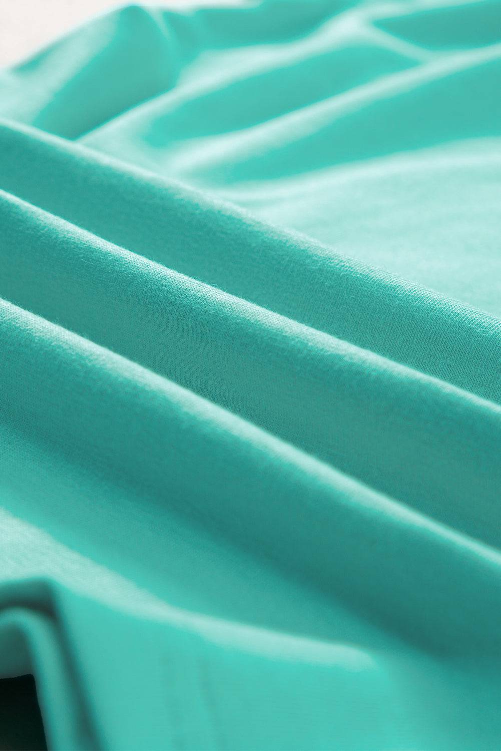 a close up of a turquoise colored fabric