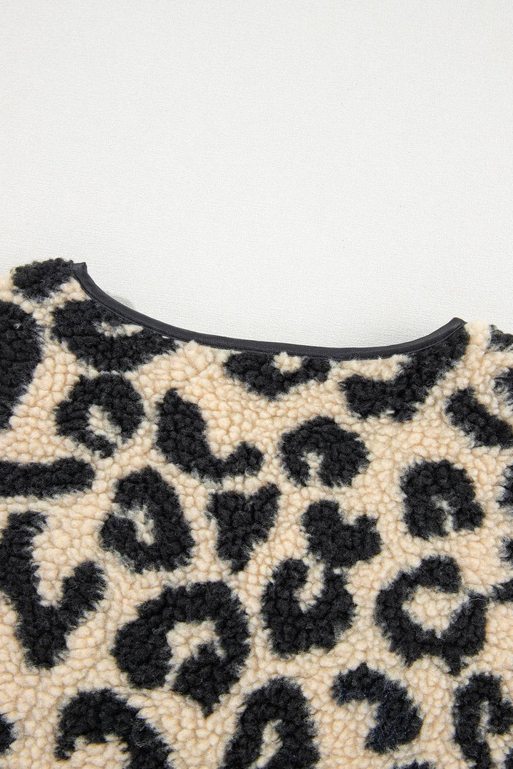 a black and white animal print purse on a white surface