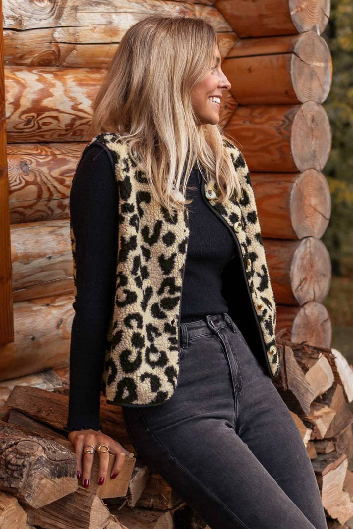 a woman sitting on top of a pile of logs