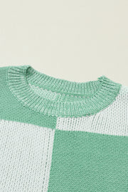 a green and white sweater with a white stripe
