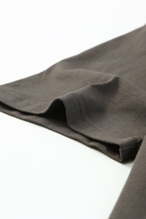 a close up of a black cloth on a white surface