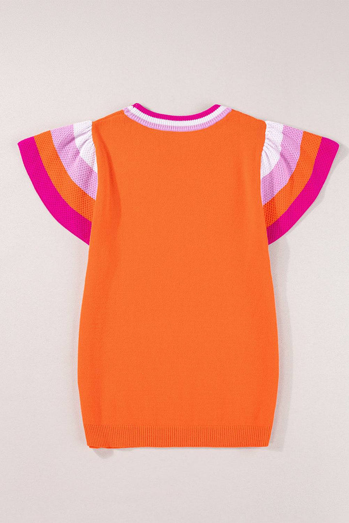 an orange sweater with pink and white stripes