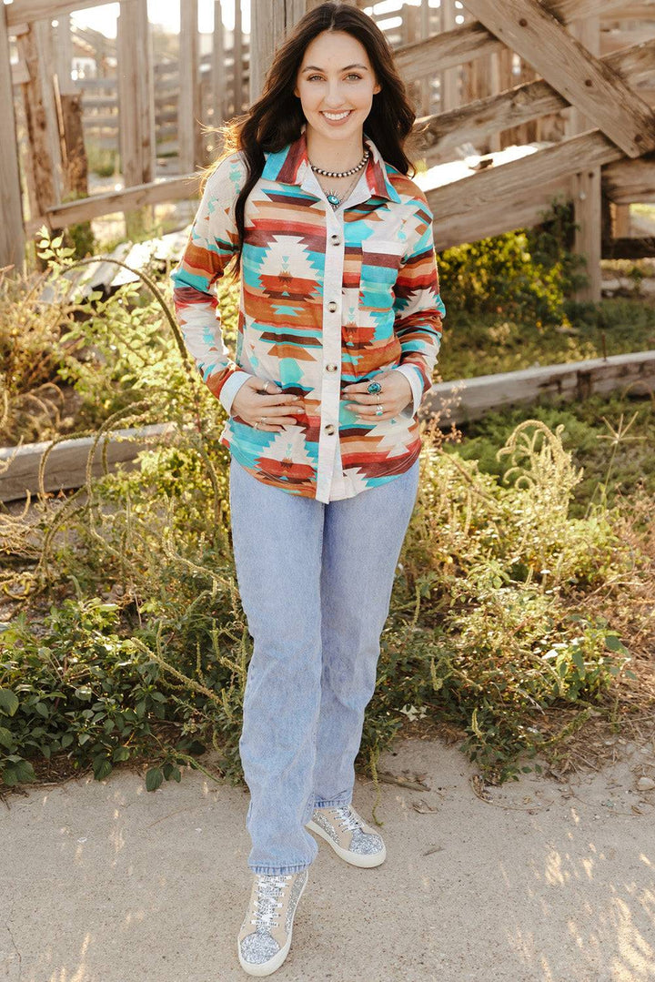 a woman standing in front of a wooden structure