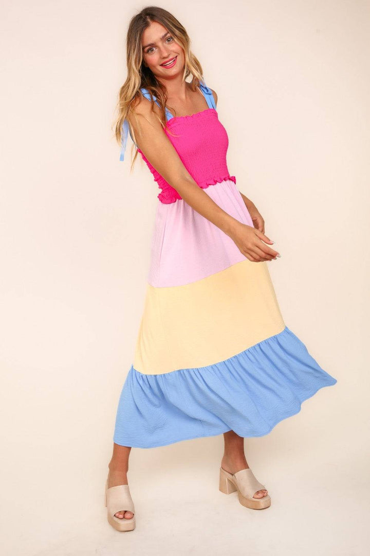 a woman in a colorful dress posing for a picture