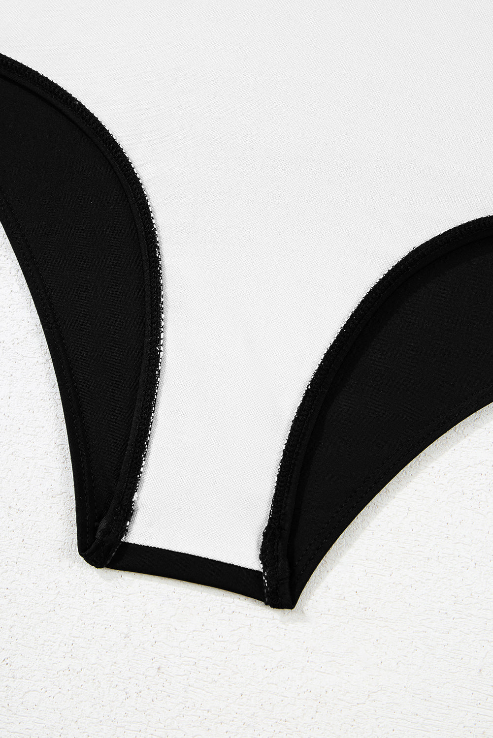 Close-up of inner lining and stitching of Black Leopard 2-tone Monokini bottom, showcasing quality craftsmanship and comfort.