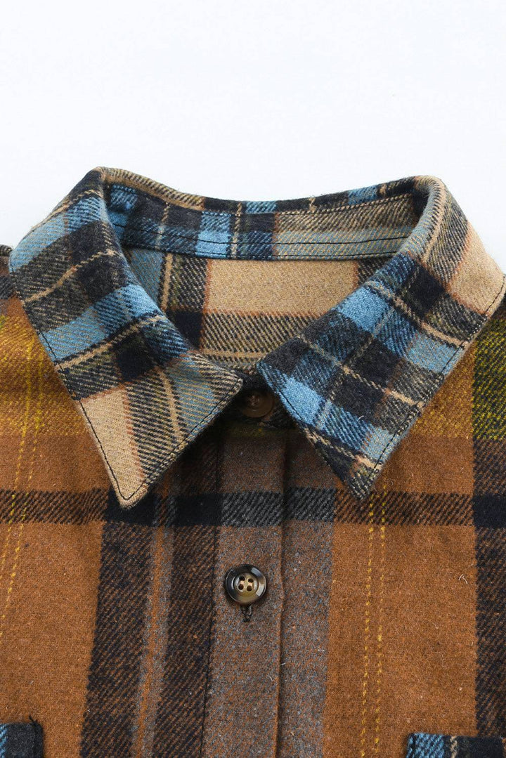 a close up of a shirt with a plaid pattern