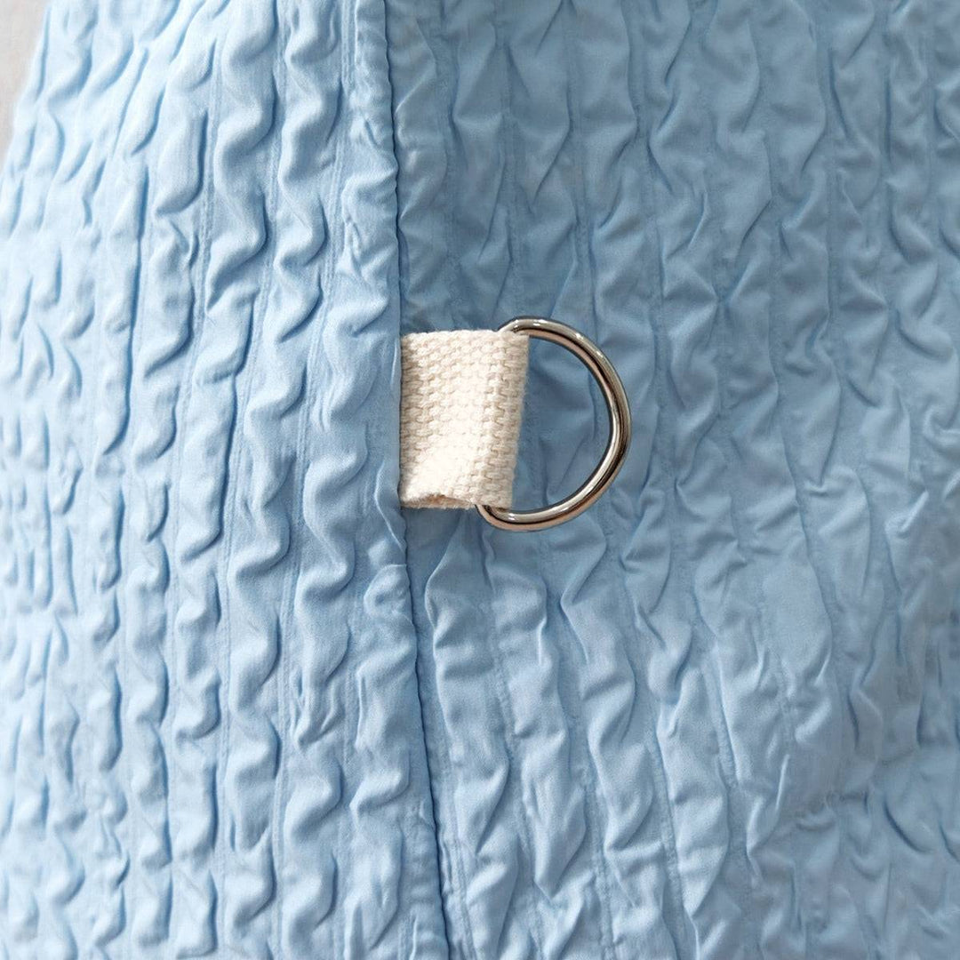 a close up of a towel with a ring on it