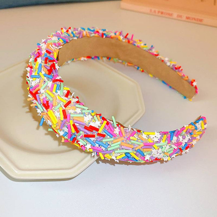 a pair of colorful bracelets sitting on top of a plate