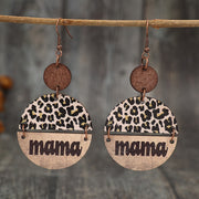 a pair of earrings with the word mama on them