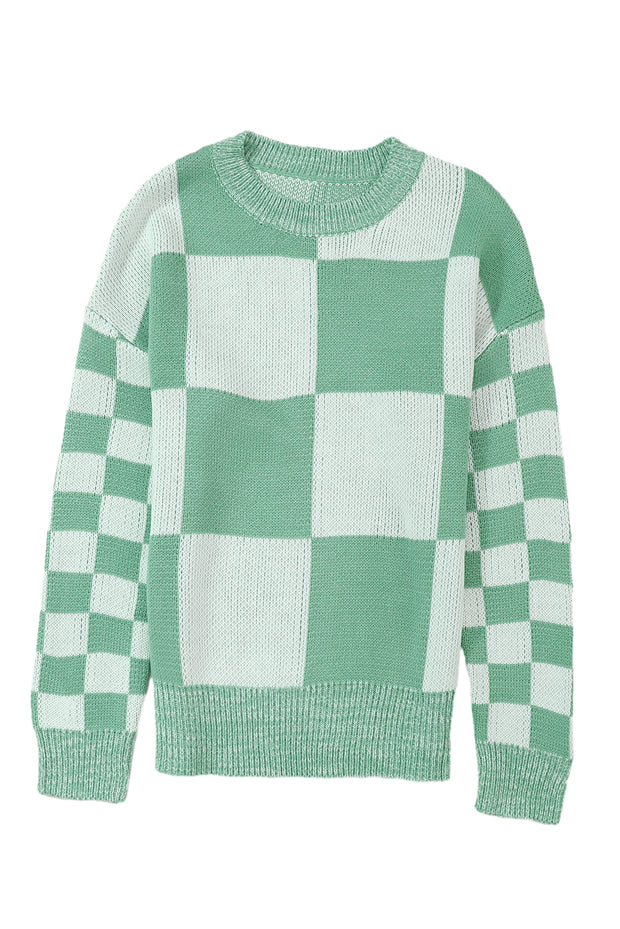 a green and white sweater with a checkered pattern