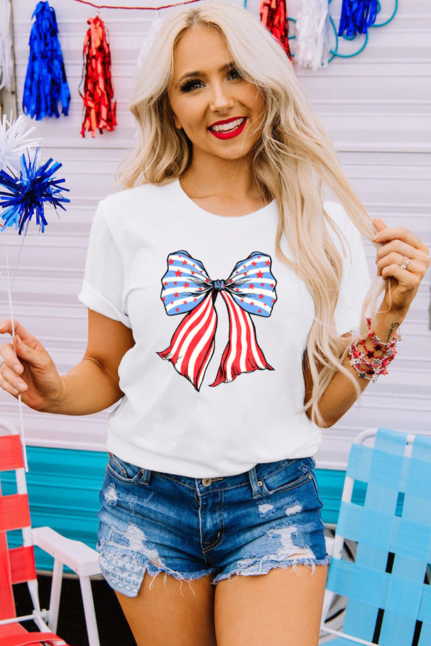 a woman wearing a white shirt with a red, white and blue bow on it