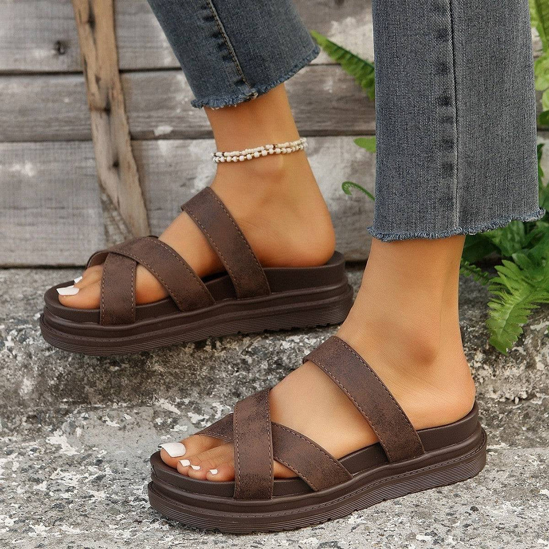 a close up of a person wearing sandals