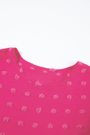 a pink t - shirt with pink flowers on it