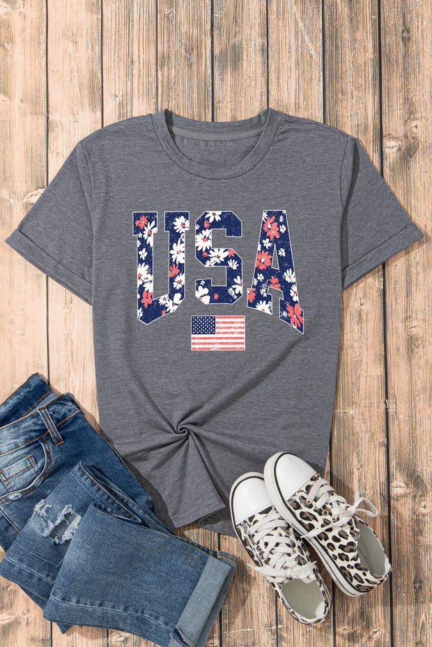 a t - shirt with the american flag on it next to a pair of jeans
