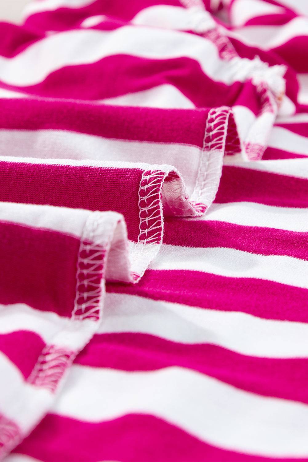 a close up of a pink and white striped shirt