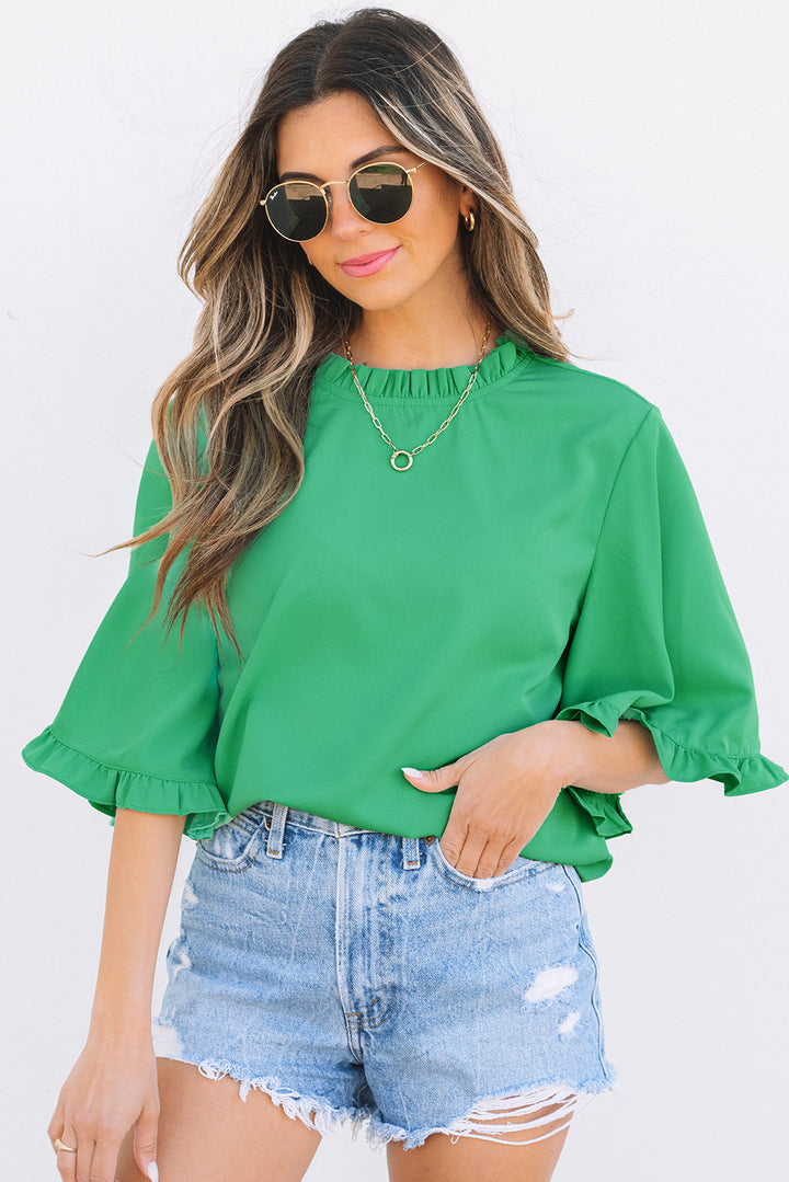 Model in Green Frilly Round Neck Wide Half Sleeve Blouse and distressed denim shorts, styled for a casual summer day.