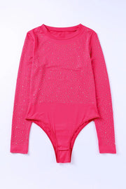 a pink bodysuit with silver stars on it