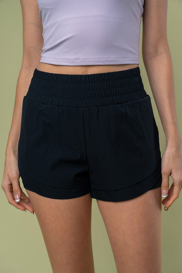 a close up of a person wearing shorts