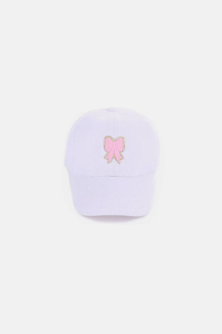 a white baseball cap with a pink teddy bear embroidered on the front