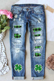 a pair of jeans with shamrock patches on them