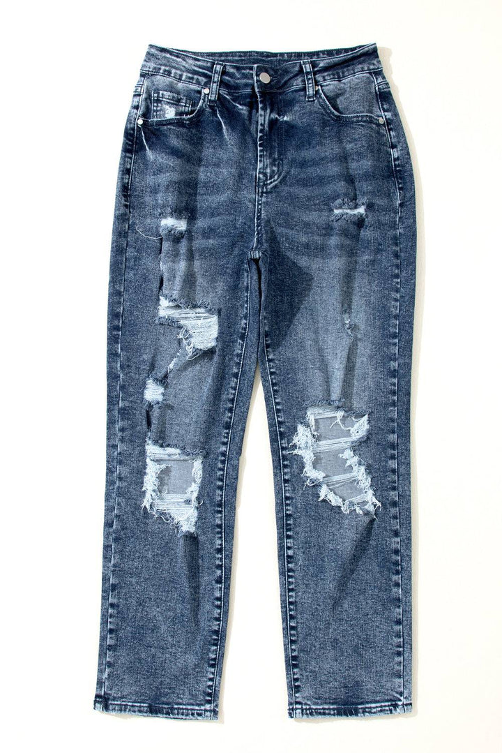 a pair of blue jeans with holes on them