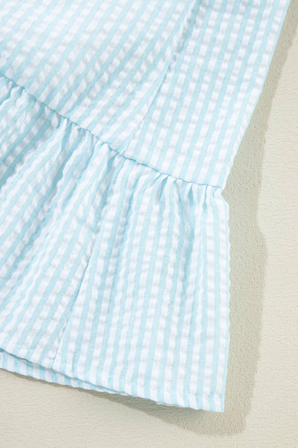 a close up of a blue and white checkered dress