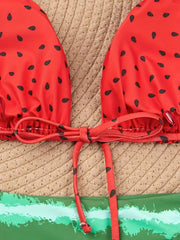 a red bikini top with black polka dots on it
