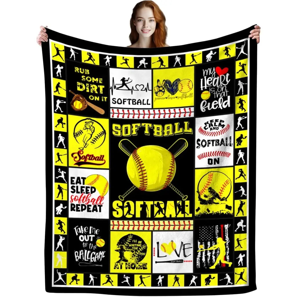 a woman holding a softball themed blanket