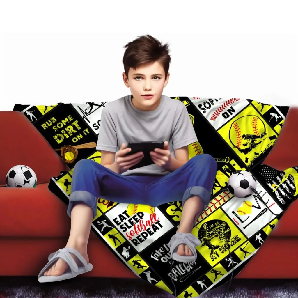 a boy sitting on a couch with a remote control