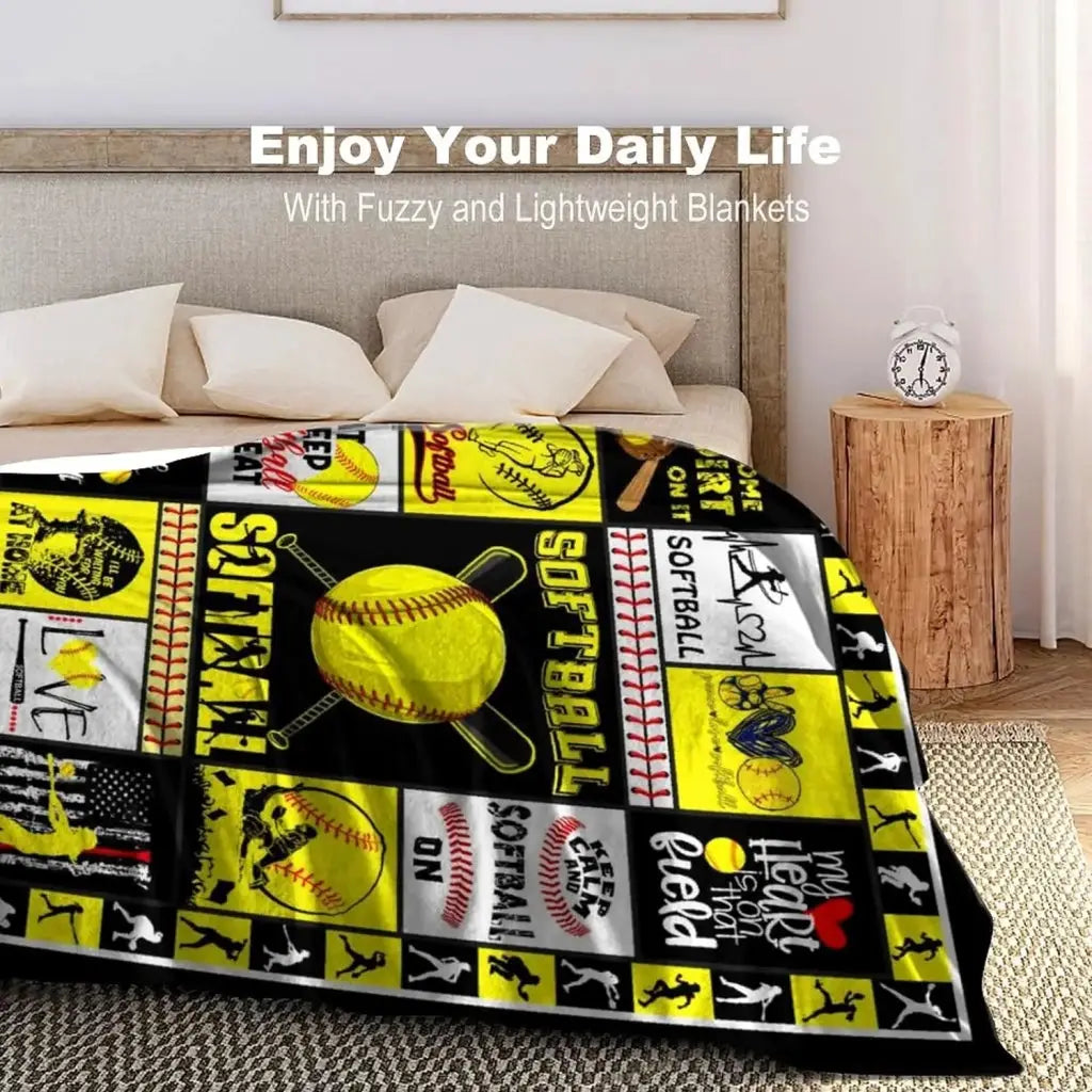 a bed covered in a yellow and black blanket