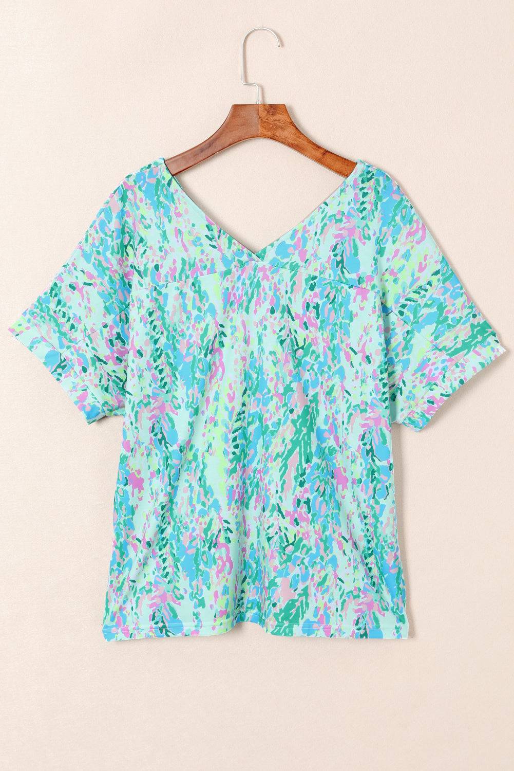 a blue top with a floral print on it