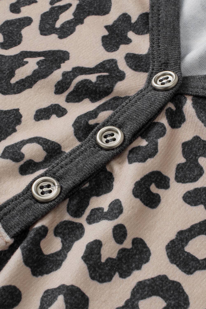 a black and white animal print shirt with buttons
