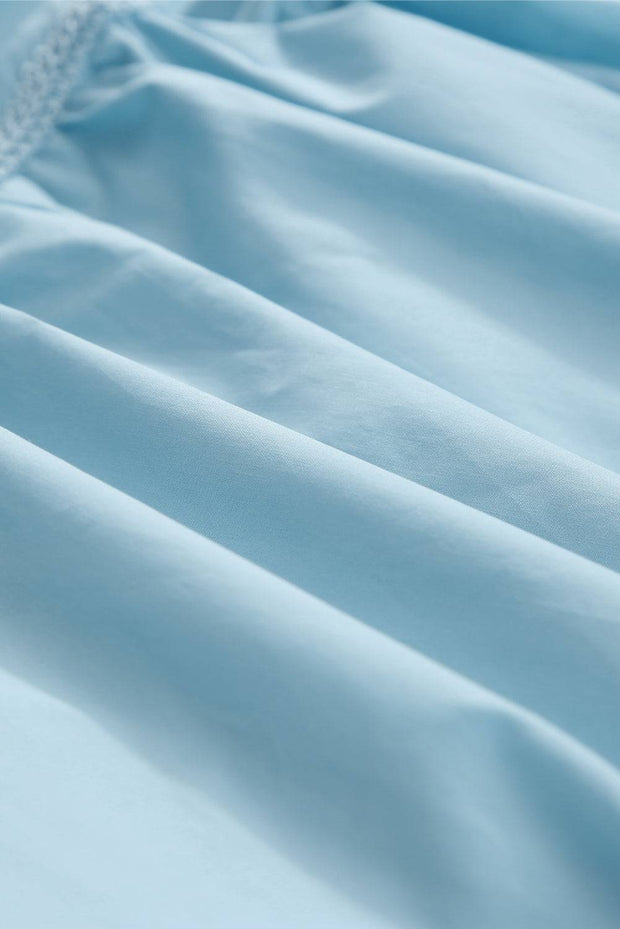 a close up of a light blue fabric