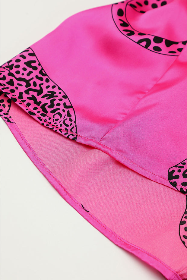 a pink and black top with a leopard print on it