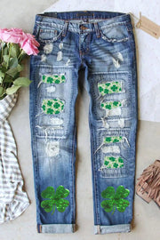 a pair of jeans with shamrocks painted on them