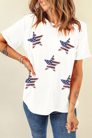 a woman wearing a white shirt with stars on it