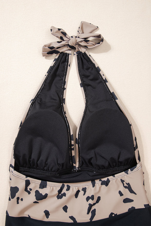 a bikini top with a bow tied to it