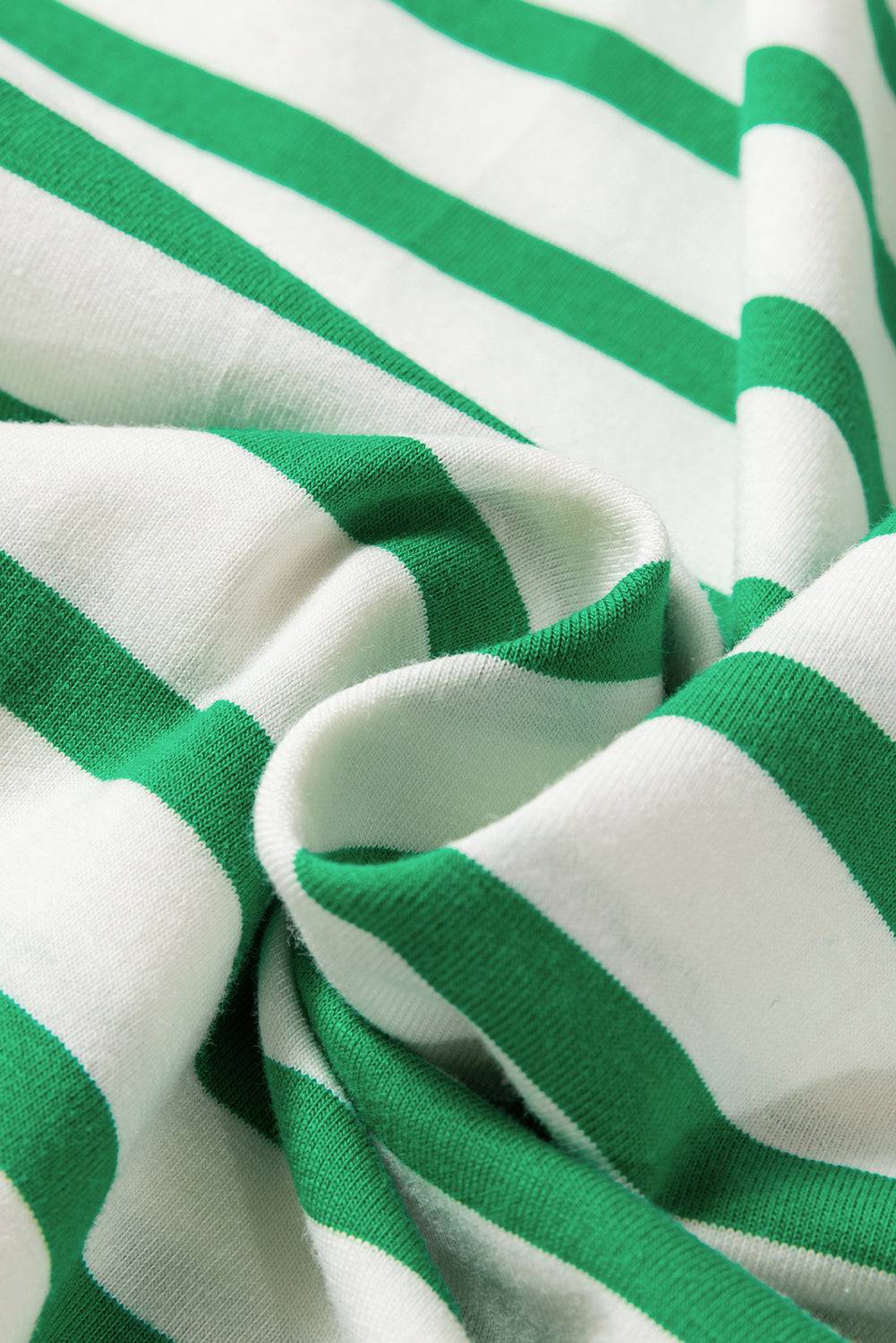 a close up of a green and white striped fabric