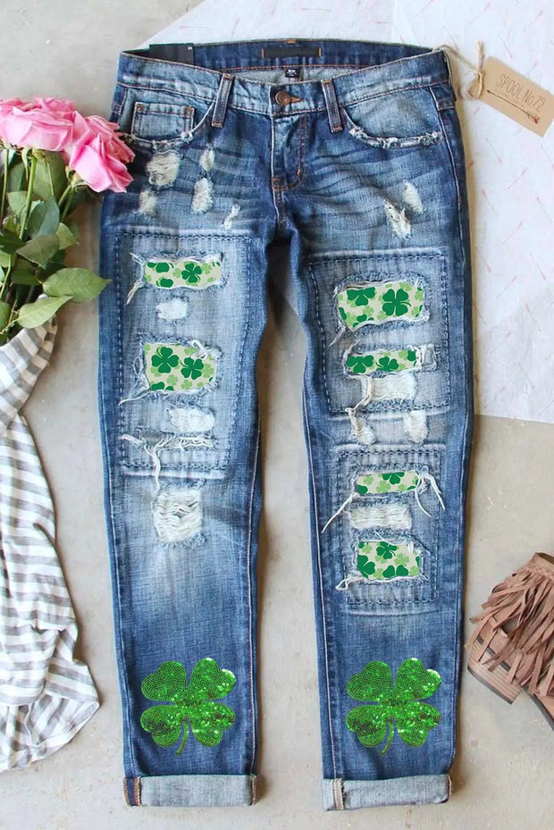 a pair of jeans with shamrocks painted on them